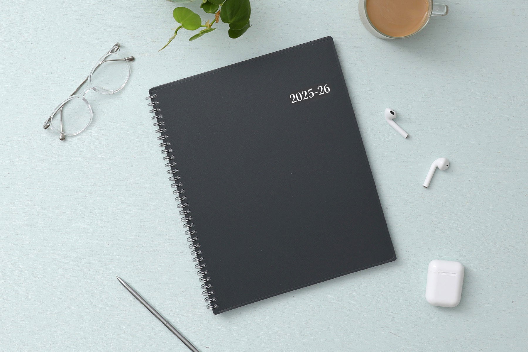 June 2025 weekly monthly academic planner featuring a solid charcoal cover and silver twin wire-o binding 8.5x11 size