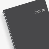 June 2025 weekly monthly academic planner featuring a solid charcoal cover and silver twin wire-o binding 8.5x11 size