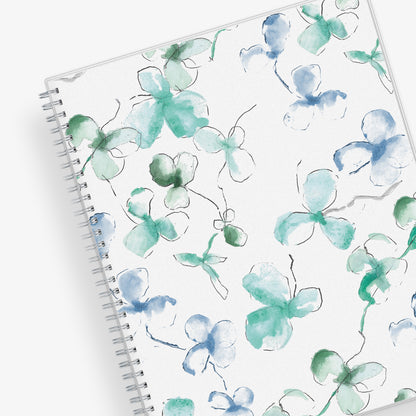January 2025 to December 2025 weekly and monthly planner from Blue Sky featuring a floral pattern in hues of blue with twin silver wire-o binding and compact 8.5x11 size