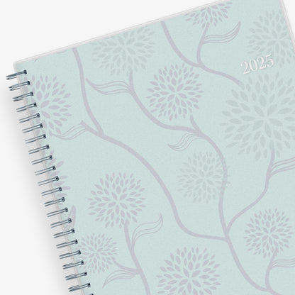 January 2025 - December 2025 weekly monthly planner featuring a floral front cover design and silver twin wire-o binding