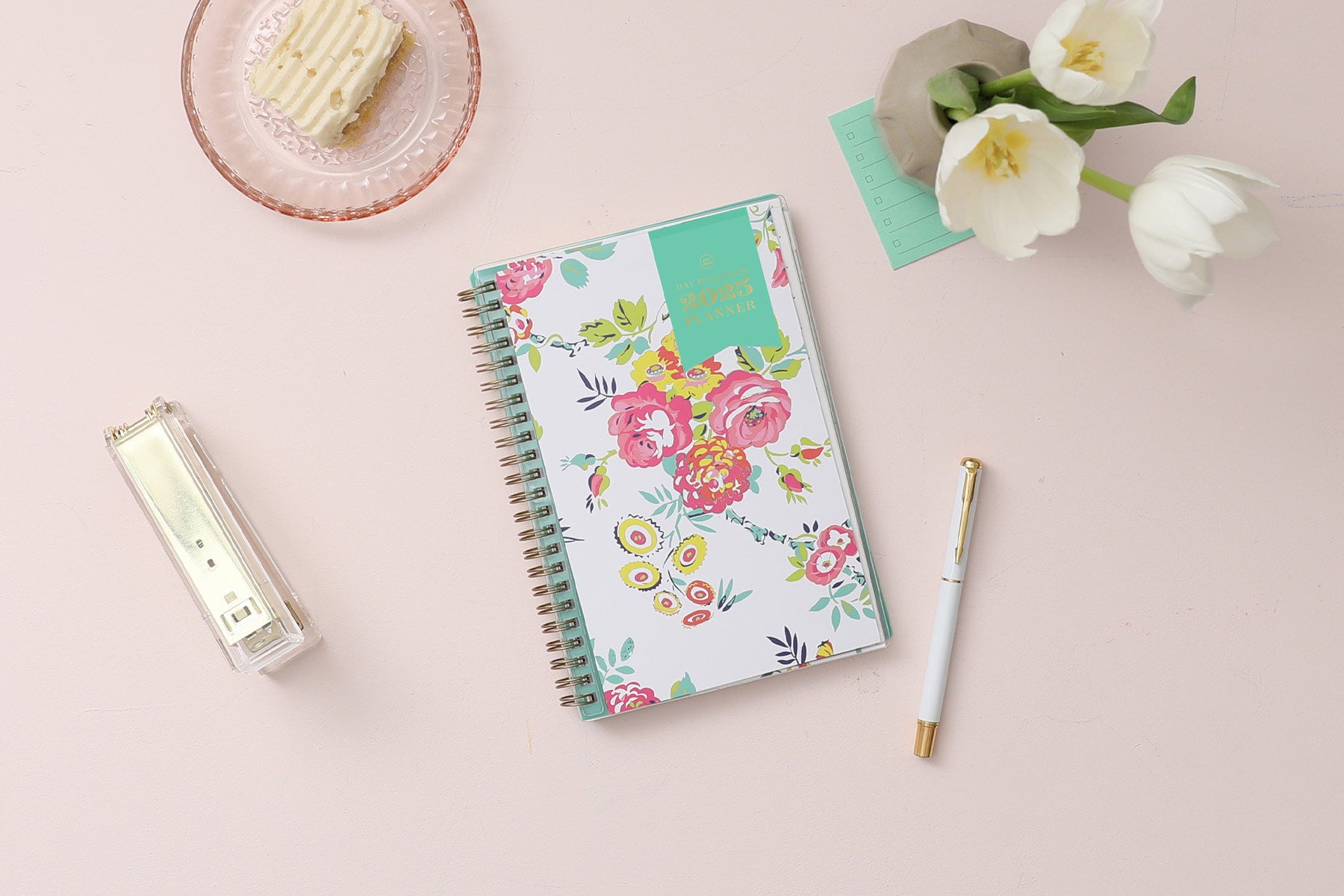 This January 2025 to December 2025 weekly monthly 5x8 planner featuring yellow and pink floral front cover pattern and gold twin wire-o binding