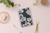 5x8 weekly monthly planner for January 2025 - December 2025 new year featuring silver twin wire-o binding, black/gray background, white florals and gold accents