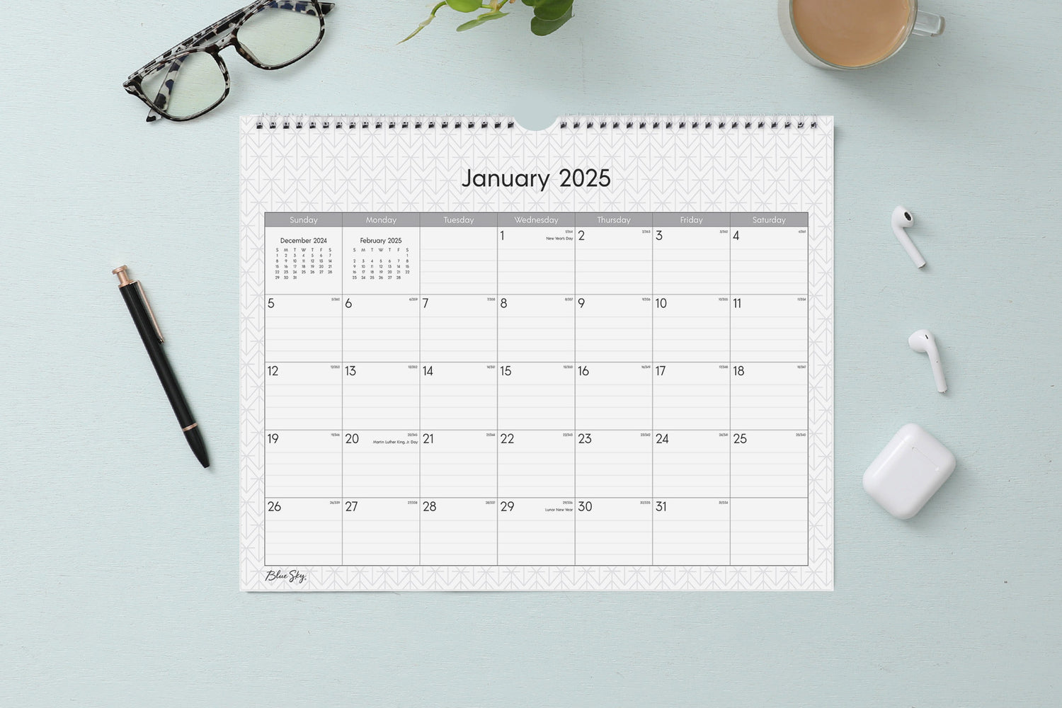 Experience this January 2025 - December 2025 clean geometric monthly wall calendar featuring reference months and ample lined writing space for each day