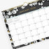 11x8.75 wall calendar for 2025 in baccara dark design featuring gold accents for months and days, black/grey background and white florals