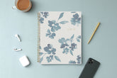 academic weekly monthly planner featuring a white background and blue paint brush florals, twin wire-o binding in a 8.5x11 planner size for the school year 2024-2025 year