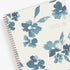 academic weekly monthly planner featuring a white background and blue paint brush florals, twin wire-o binding in a 8.5x11 planner size for the school year 2024-2025 year