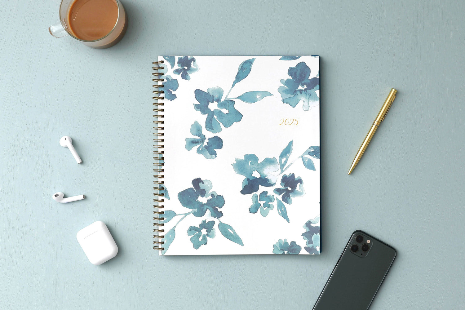 blue sky weekly monthly 2025 planner featuring blue water brushed florals and beige background cover