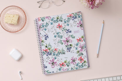 Blue Sky January 2025 - December 2025 weekly monthly planner featuring a floral front cover design with silver wire-o binding