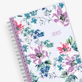 Blue Sky January 2025 - December 2025 weekly monthly planner featuring a floral front cover design with silver wire-o binding