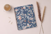 in partnership with one tree planted, the 2025 weekly monthly planner features a cute floral pattern and navy background cover.