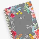 2025 weekly monthly planner featuring floral pattern and gold twin wire-o binding in 5x8 planner size