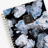 2025 Rachel Parcell daily planner featuring a beautiful floral pattern hardcover on gold twin wire-o binding in a 7x9 size.