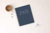 2025 weekly monthly planner in 8.5x11 planner size. Navy front cover