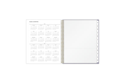 This 8.5x11 2025 weekly monthly planner featuring a yearly overview for both 2025 and 2026, a yearly goals recap to review end of the year, and contact page.