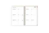 2025 planner featuring a weekly spread with lined writing space, bullet points, and monthly white tabs with gold text.
