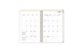 2025 planner featuring a monthly spread with lined writing space, bullet points, and monthly white tabs with gold text.
