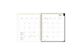 2025 planner featuring a weekly spread with lined writing space, bullet points, and monthly white tabs with gold text.
