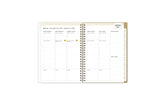 2025 planner featuring a weekly spread with lined writing space, bullet points, and monthly white tabs with gold text.
