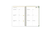 2025 planner featuring a weekly spread with lined writing space, bullet points, and monthly white tabs with gold text.
