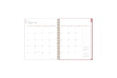 The 2025 Rach Parcell planner features a monthly view with ample blank white writing space, reference calendars, notes section, and soft pink monthly tabs. 8.5x11