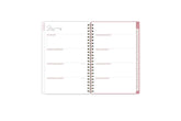 The 2025 Rach parcell planner features a weekly spread view with top goals for the week, blank white writing space for each day, and soft pink monthly tabs.