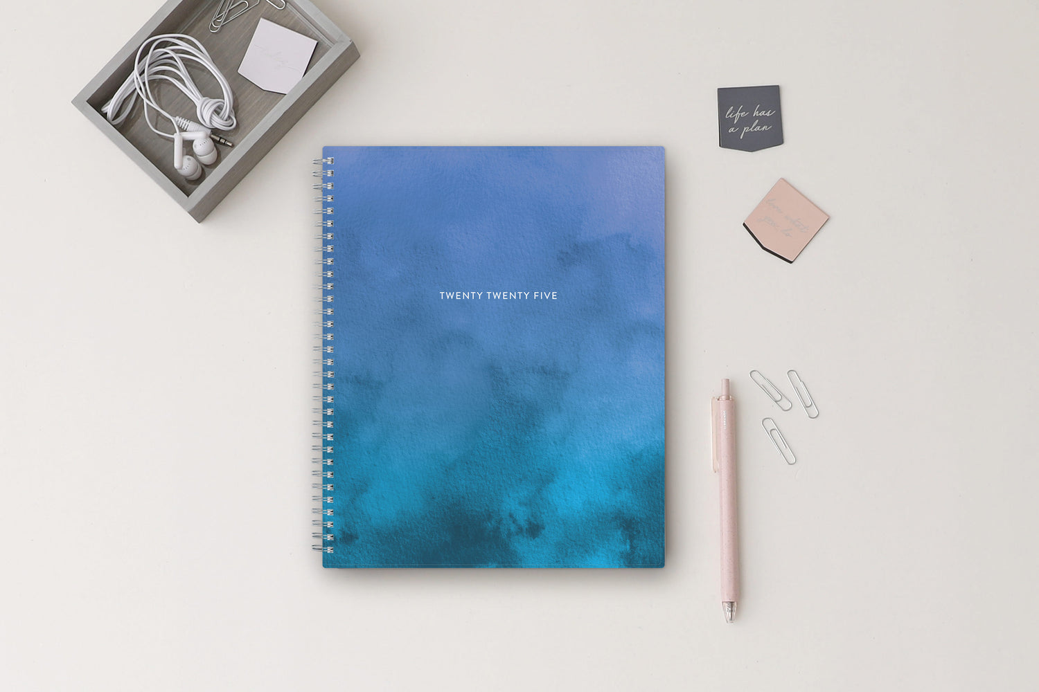 January 2025 to December 2025 weekly planner featuring a solid flexible oceanic ombre front cover, silver twin wire-o, and a 8.5x11 size planner