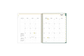 2025 planner featuring a monthly spread with lined writing space, bullet points, and monthly white tabs with gold text.
