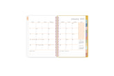 2025 planner featuring a monthly spread with lined writing space, bullet points, and monthly white tabs with gold text.
