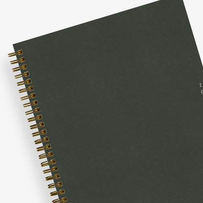 solid dark green front cover on this 2025 planner 7x9