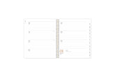 2025 planner featuring a weekly spread with lined writing space, bullet points, and monthly white tabs with black text.
