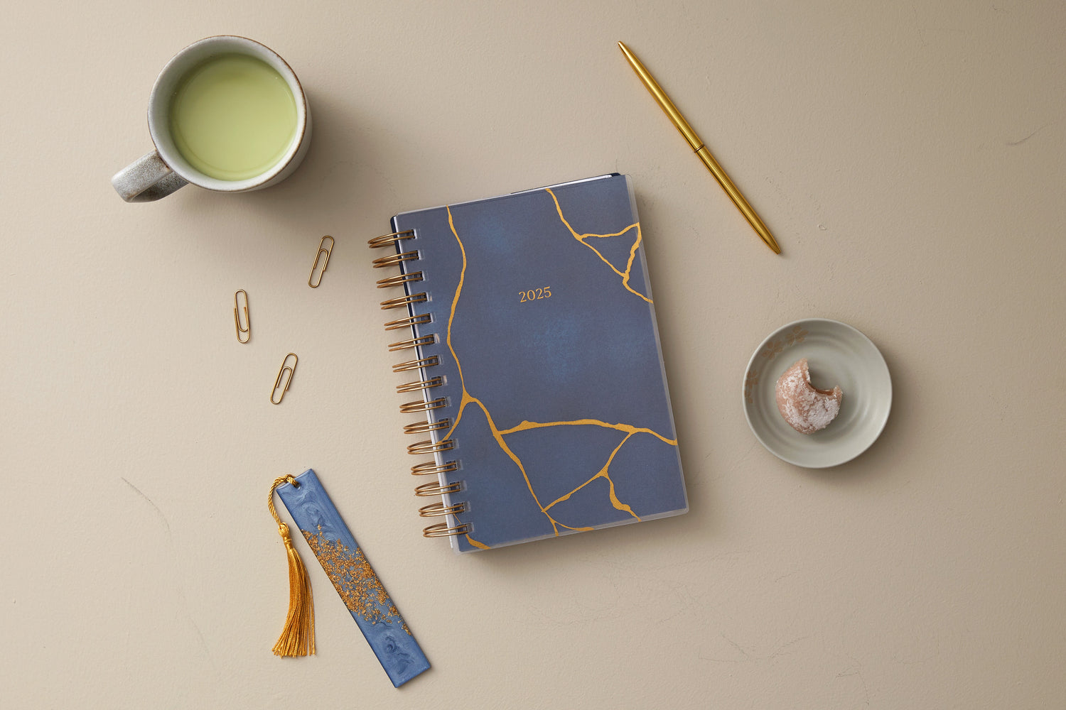 gold marble and cloudy blue background cover on this 2025 planner