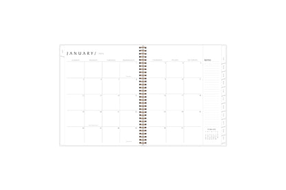 2025 planner featuring a monthly spread with lined writing space, and space for bullet points, and monthly white tabs with black text.
