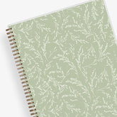 white wisteria floral and light olive green background on this 2025 planner in 8.5x11 size