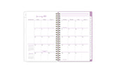 2025 planner featuring a monthly spread with blank writing space, bullet points, and monthly white tabs with purple text.
