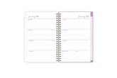 2025 planner featuring a weekly spread with lined writing space, bullet points, and monthly white tabs with purple text.
