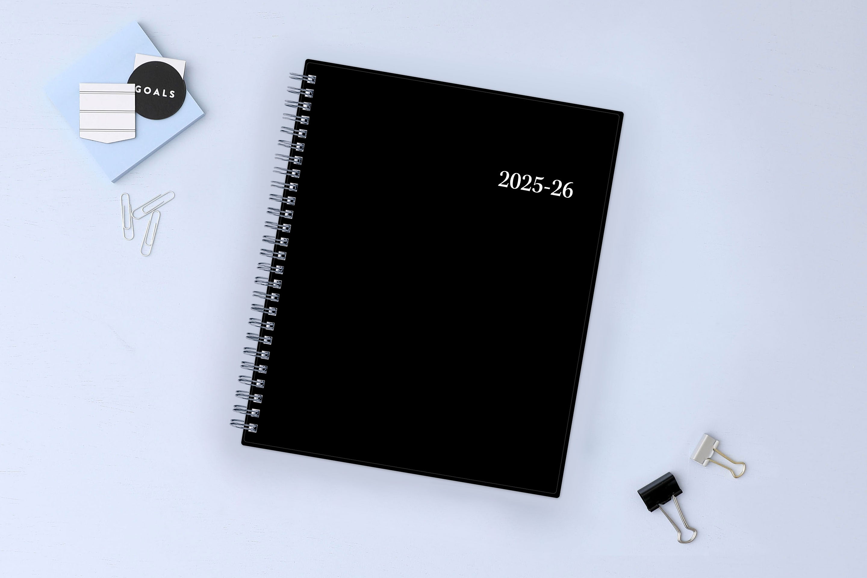 monthly academic planner featuring a solid black cover and silver twin wire-o binding 8x10 size for july 2025 - june 2026