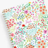  academic teacher lesson planner with weekly and monthly layouts featuring a multi colored floral front cover in 8.5x11 planner size
