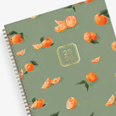 oranges front cover with olive background on this 8.5x11 2025-2026 academic planner