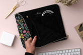 8x10 floral accessory pouch with a zipper enclosure fits cables, phones, and external batteries.